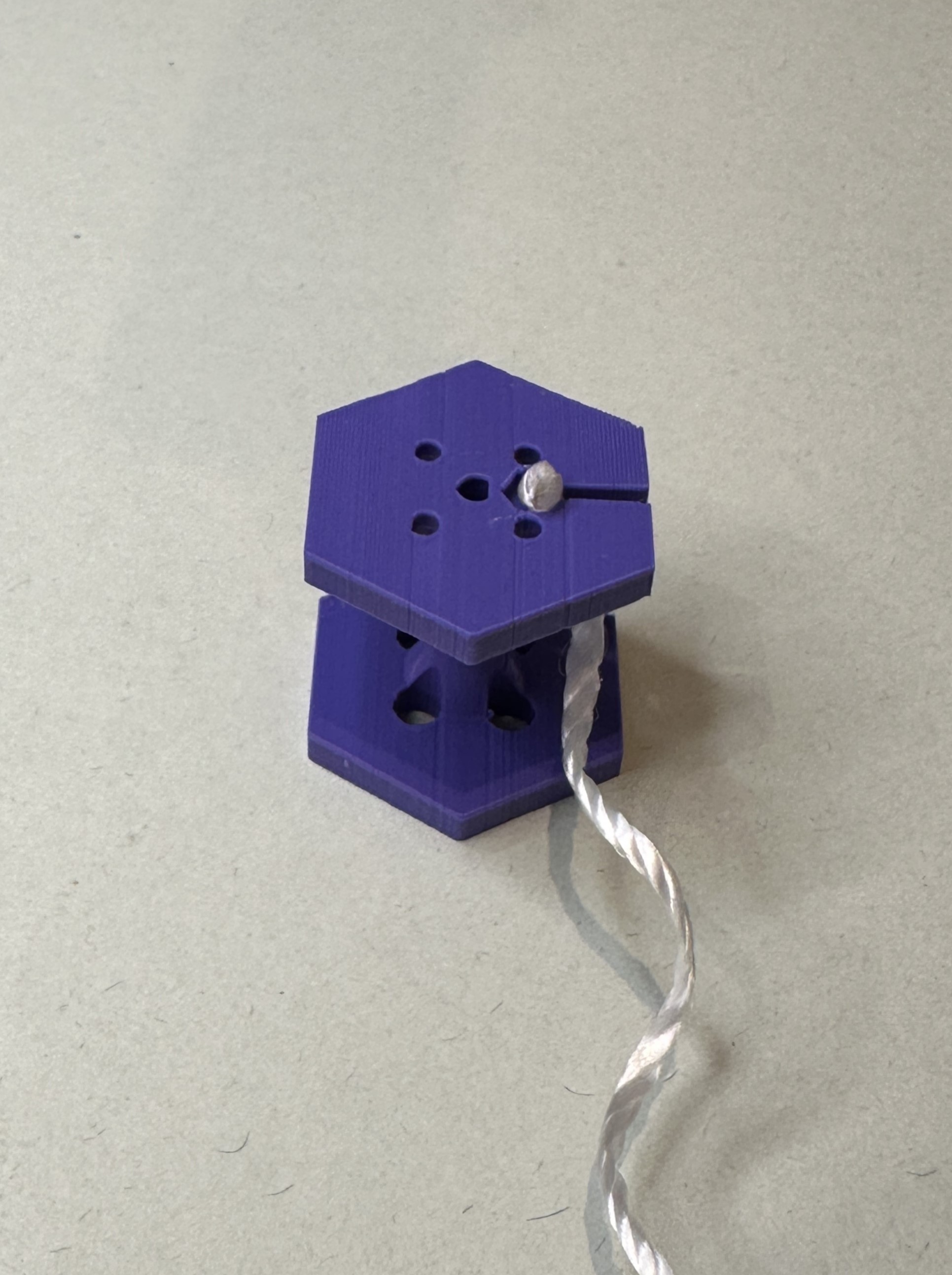 Showing the torque pull string knot held inside the recess.