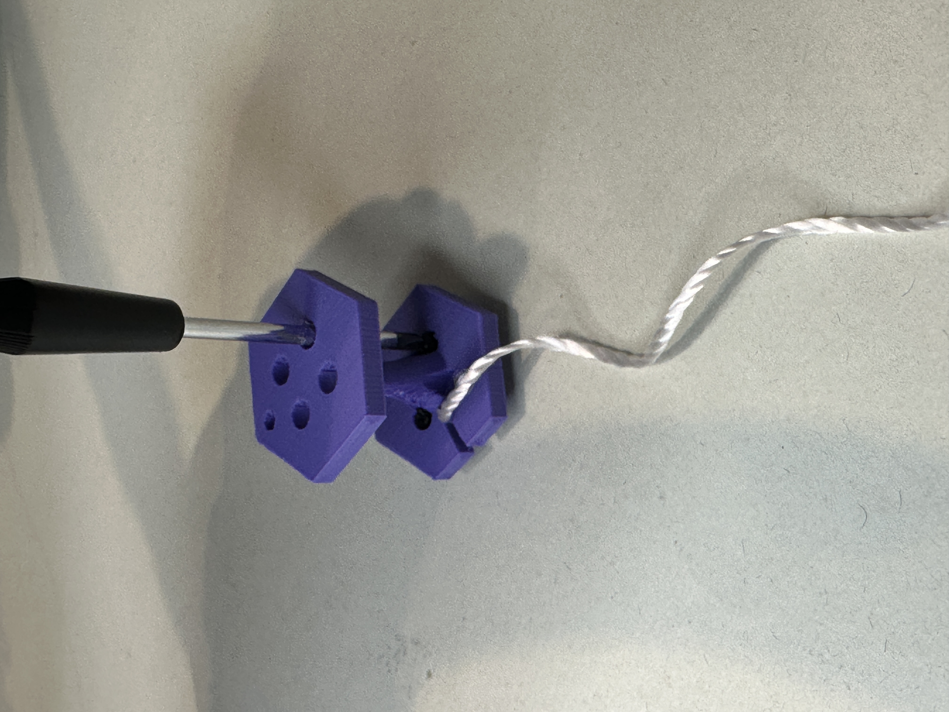 Showing how to gain access to tighten the screws.