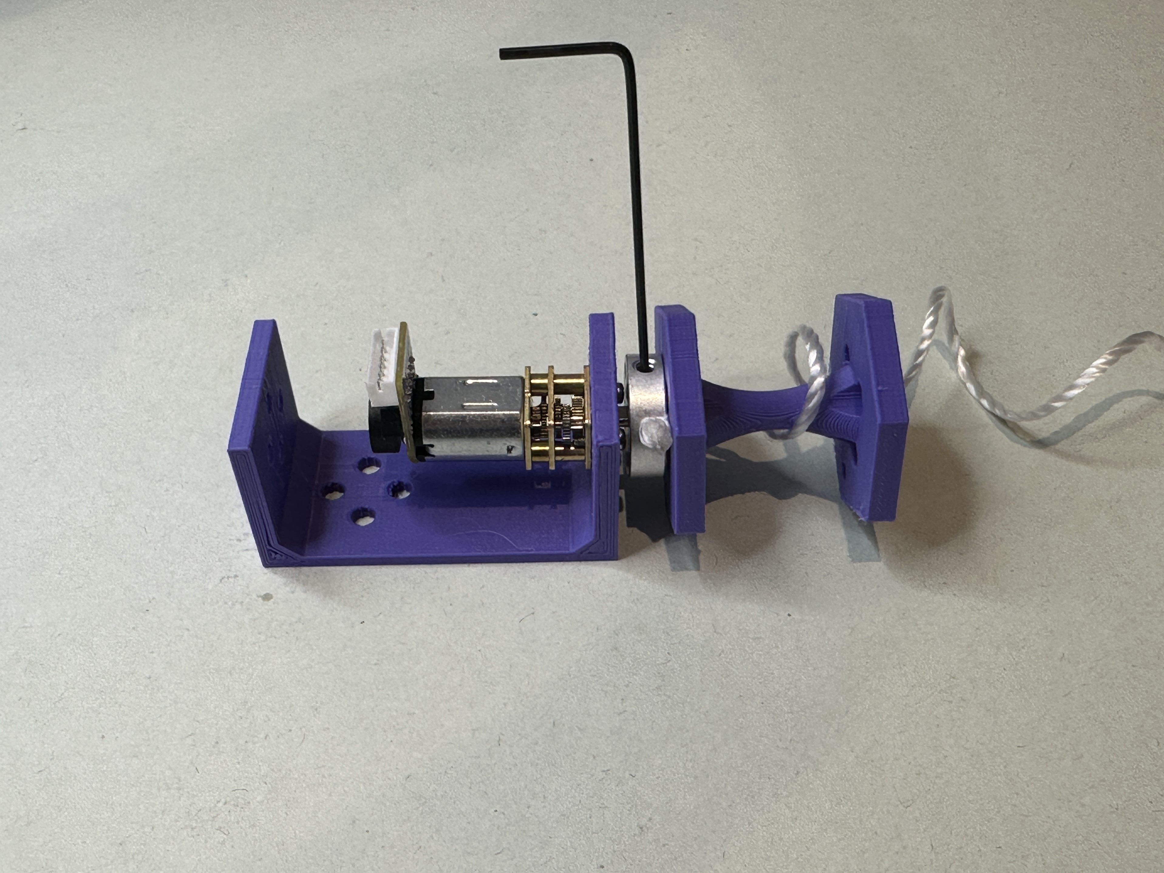 Showing how to position and tight the set screw onto the motor shaft.